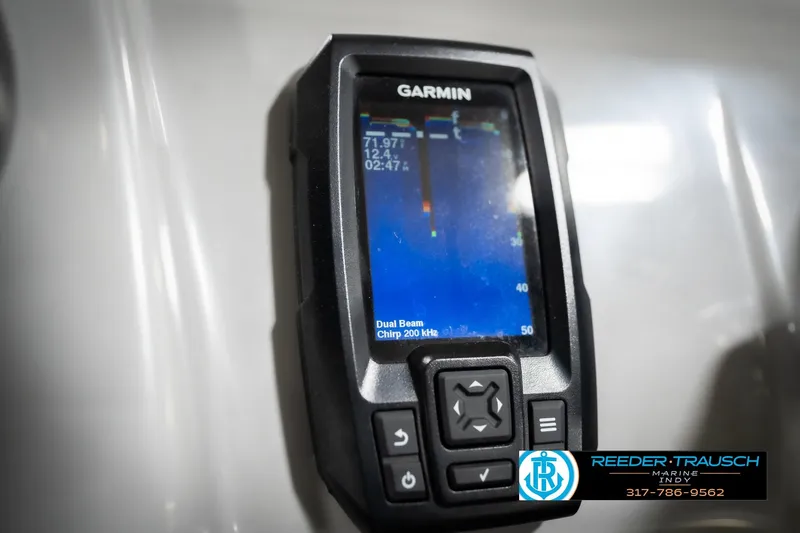 Slide: The Image of Garmin fishfinder on 2023 Bennington 20 SV boat dashboard, Reeder-Trausch Marine logo visible. - 41