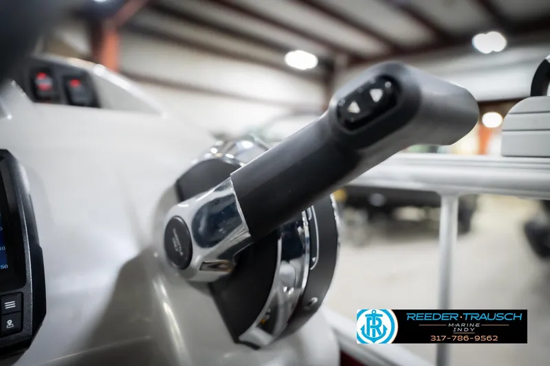 Slide: The Image of Close-up of 2023 Bennington 20 SV boat throttle control in a showroom. - 42