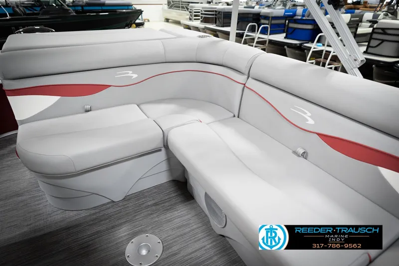 Slide: The Image of 2023 Bennington 20 SV pontoon boat interior with gray and red seating. - 45
