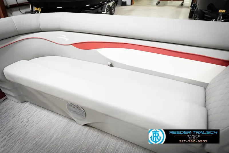 Slide: The Image of 2023 Bennington 20 SV boat interior with gray and red seating, Reeder-Trausch Marine logo. - 46