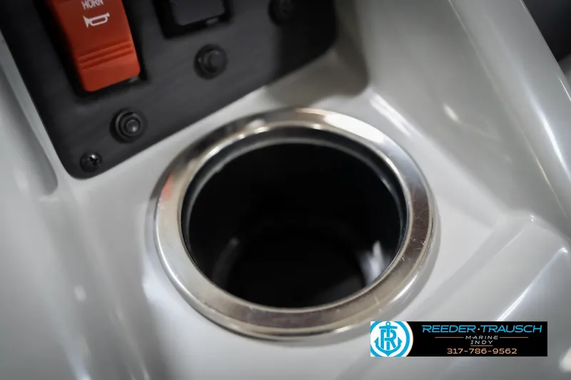 Slide: The Image of 2023 Bennington 20 SV boat console with cup holder and control panel. - 48