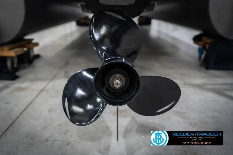 Slide: The Image of 2023 Bennington 20 SV boat propeller in a showroom, Reeder-Trausch Marine logo visible. - 54