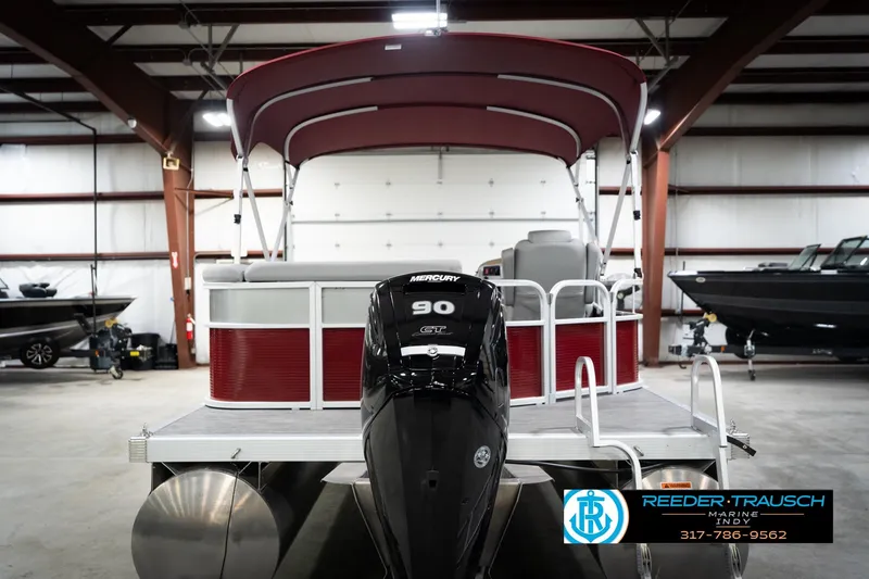 Slide: The Image of 2023 Bennington 20 SV pontoon boat with Mercury 90 engine in showroom. - 9