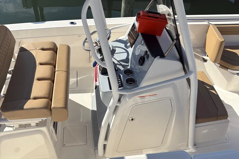 Slide: The Image of 2025 Trophy T22CC boat interior with beige seating and modern console. - 3