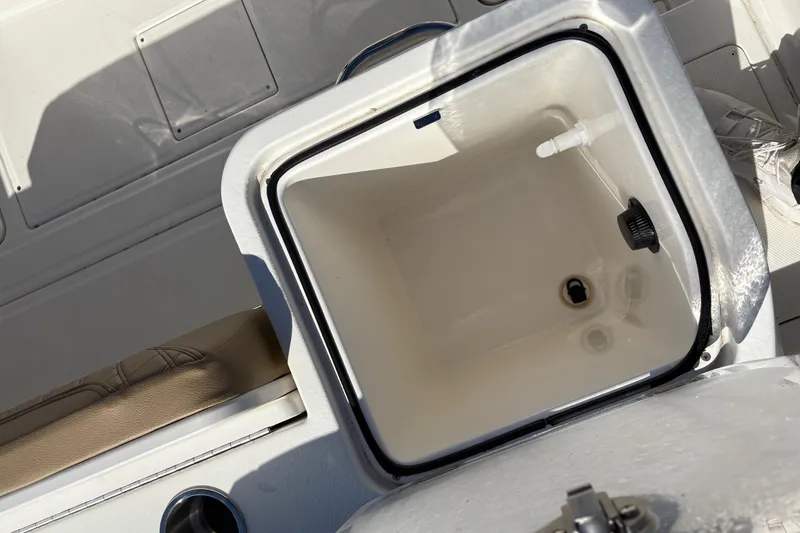 Slide: The Image of Open storage compartment on 2025 Trophy T22CC boat, featuring a clean interior. - 4
