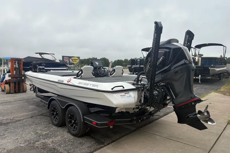 Slide: The Image of 2026 Skeeter ZXE21 boat with powerful outboard motor on a trailer. - 2
