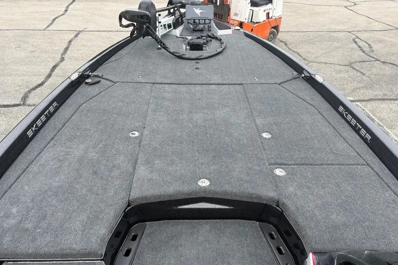 Slide: The Image of 2026 Skeeter ZXE21 boat deck with gray carpeting and sleek design. - 5
