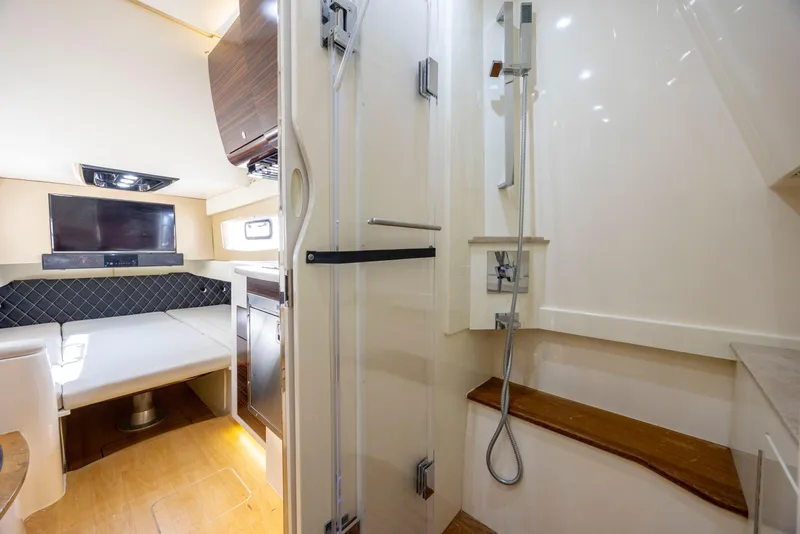 Slide: The Image of Helm of 2019 Scout 420 LXF boat with advanced navigation displays and controls. - 18