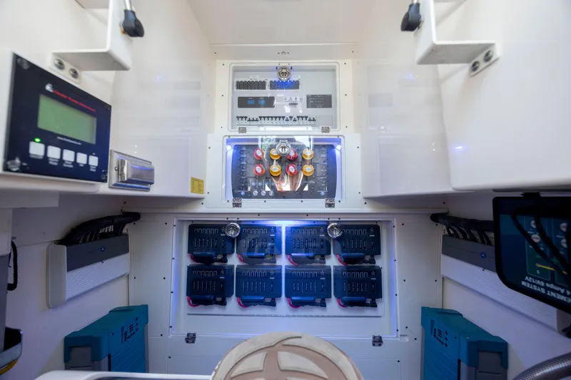 Slide: The Image of Luxurious 2019 Scout 420 LXF boat interior with elegant seating and table on a sunny day. - 20