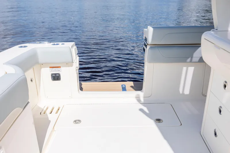 Slide: The Image of Luxurious 2019 Scout 420 LXF yacht interior with wood finish and modern amenities. - 28