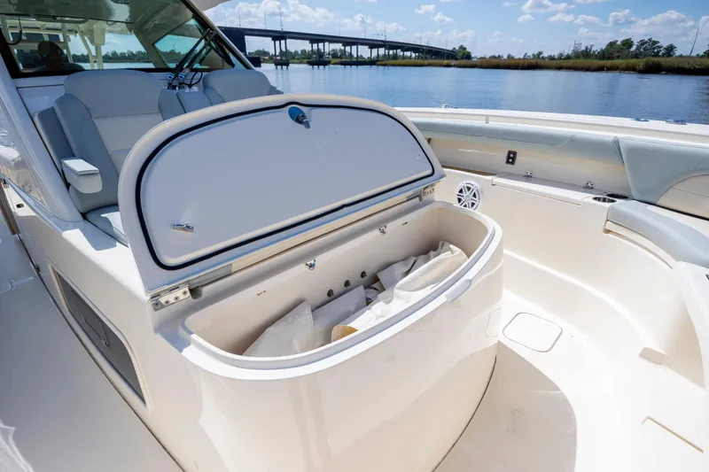 Slide: The Image of Engine compartment of 2019 Scout 420 LXF boat, showcasing wiring and mechanical components. - 45