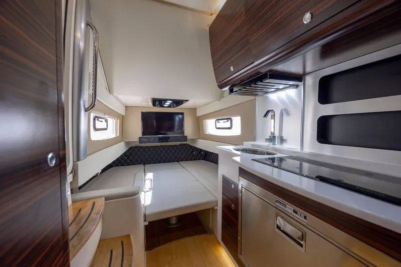 Slide: The Image of Four Mercury outboard engines on a 2019 Scout 420 LXF boat near a bridge. - 9