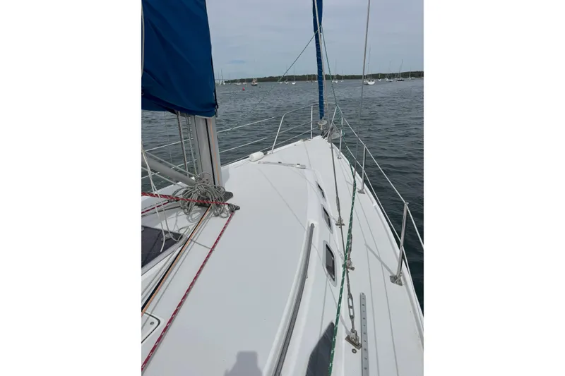 Slide: The Image of 1999 Catalina 34 MkII sailboat deck view on calm waters. - 2