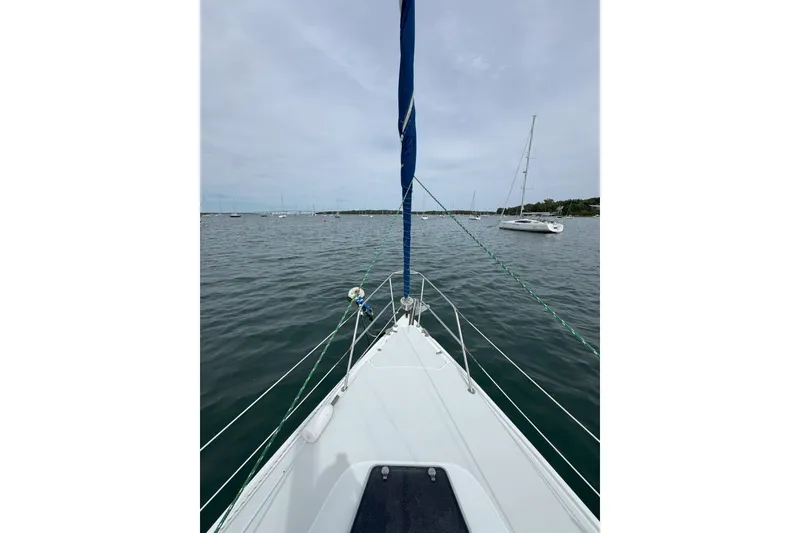 Slide: The Image of Bow view of 1999 Catalina 34 MkII sailboat on calm water. - 20