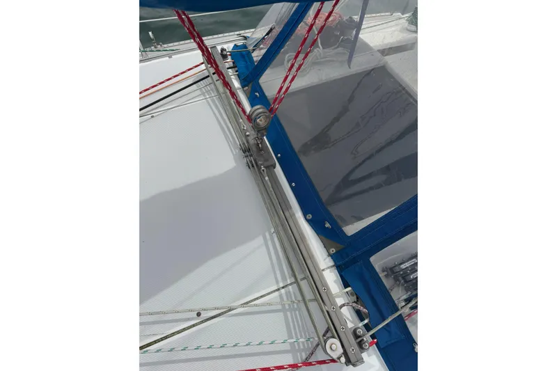 Slide: The Image of 1999 Catalina 34 MkII sailboat deck with rigging and blue canvas cover. - 21