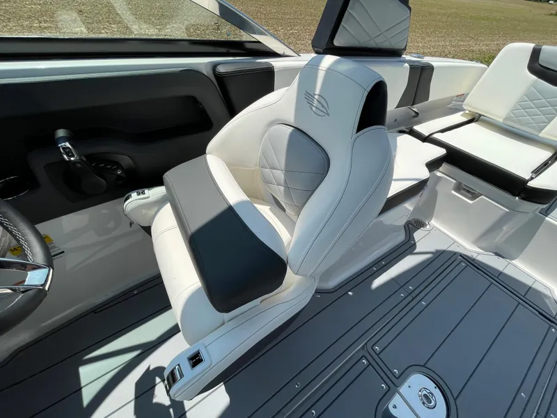 Slide: The Image of 2024 Chaparral 250 OSX boat speaker and capacity warning labels - 22