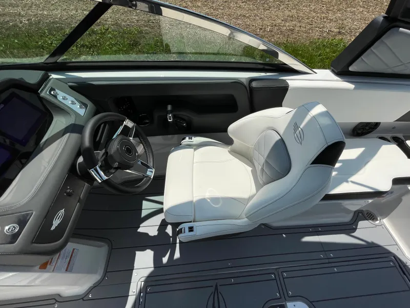 Slide: The Image of 2024 Chaparral 250 OSX boat interior with luxurious seating and modern design. - 23