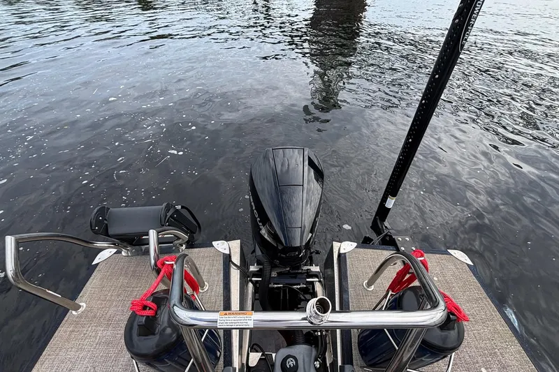 Slide: The Image of 2023 Barletta Corsa 25U boat engine and deck on water. - 15