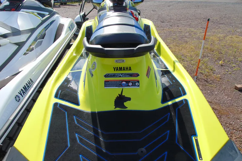 Slide: The Image of 2020 Yamaha WaveRunner GP1800R SVHO in vibrant yellow, rear view on gravel. - 5