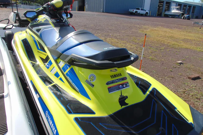 Slide: The Image of 2020 Yamaha WaveRunner GP1800R SVHO in vibrant yellow and blue, parked outdoors. - 6