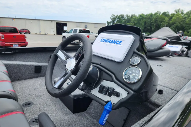 Slide: The Image of 2023 Ranger RT188P boat dashboard with Lowrance GPS and steering wheel. - 11