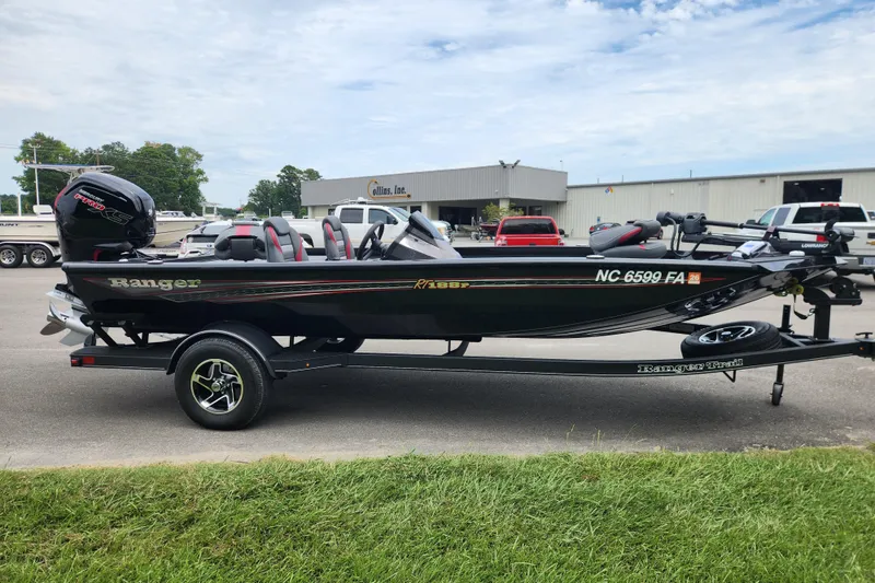 Slide: The Image of 2023 Ranger RT188P fishing boat on trailer, parked outdoors. - 5