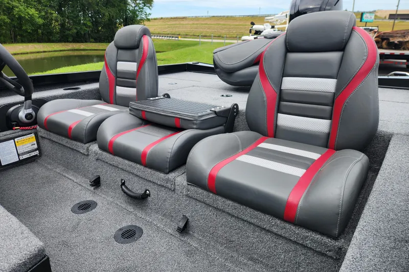 Slide: The Image of 2023 Ranger RT188P boat interior with gray and red cushioned seats. - 9