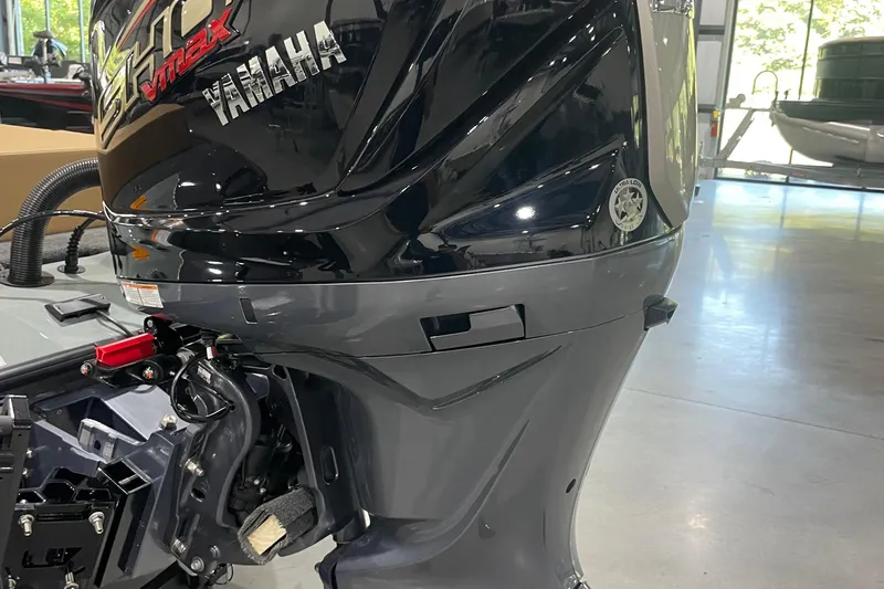 Slide: The Image of 2026 Skeeter ZXE20 with Yamaha VMAX outboard motor in a showroom. - 4