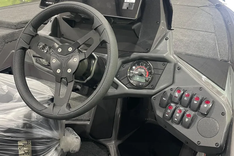 Slide: The Image of 2026 Skeeter ZXE20 boat dashboard with steering wheel and control panel. - 8