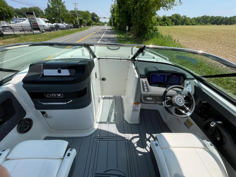 Slide: The Image of 2024 Chaparral 250 OSX boat interior with modern dashboard and seating. - 16