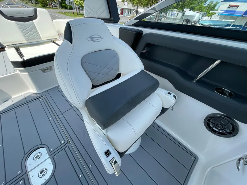 Slide: The Image of 2024 Chaparral 250 OSX boat interior with white and gray seating. - 28