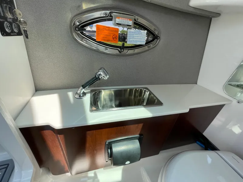 Slide: The Image of 2024 Chaparral 250 OSX boat interior sink and countertop area. - 31
