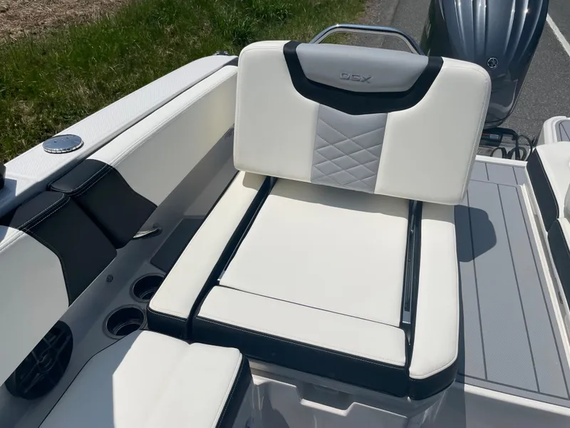 Slide: The Image of 2024 Chaparral 250 OSX boat with white and black seating. - 41