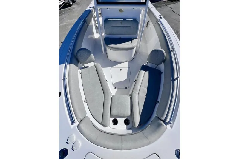 Slide: The Image of 2021 Sportsman Heritage 251 Center Console boat interior with cushioned seating. - 4