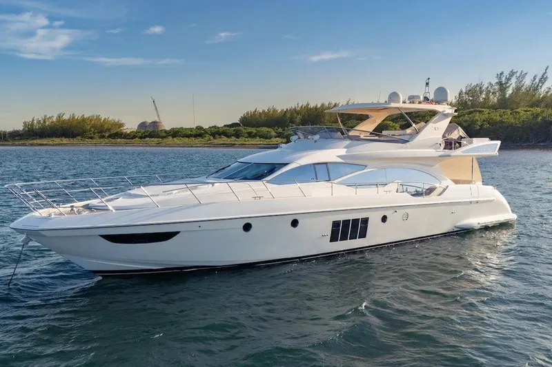 Slide: The Image of Luxurious 2012 Azimut Evolution yacht cruising on serene waters. - 13