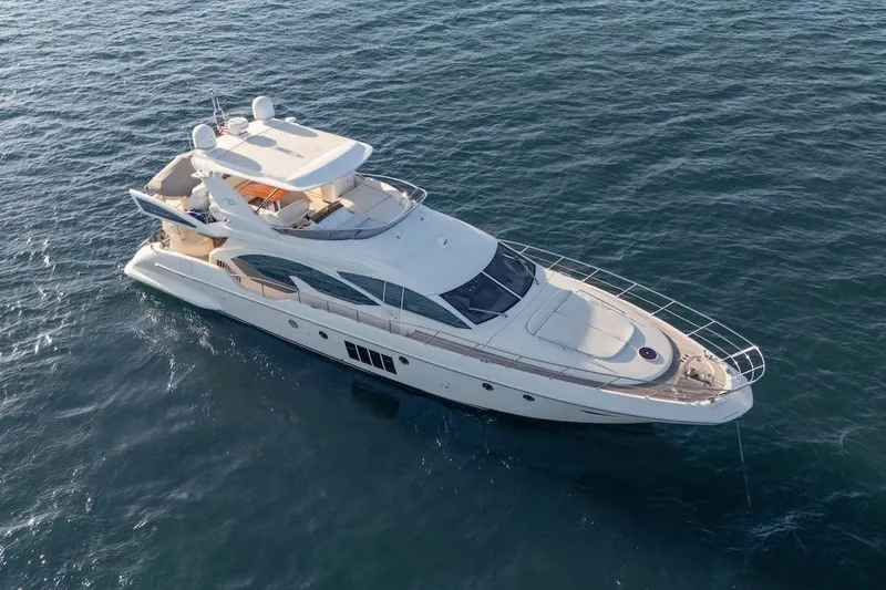 Slide: The Image of Luxury 2012 Azimut Evolution yacht cruising on open water. - 15