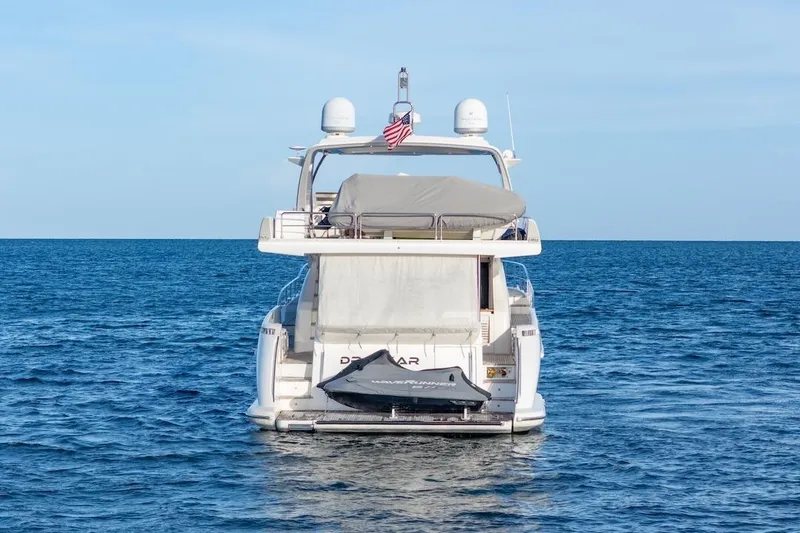 Slide: The Image of 2012 Azimut Evolution yacht on open sea, rear view with jet ski. - 17