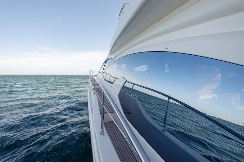 Slide: The Image of 2012 Azimut Evolution yacht cruising on open sea, reflecting blue sky and ocean. - 19