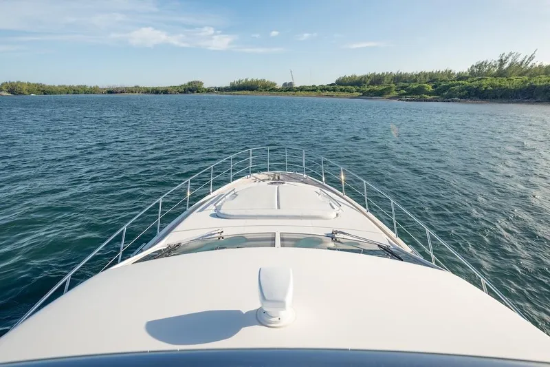 Slide: The Image of Bow view of 2012 Azimut Evolution yacht cruising on a serene waterway. - 22