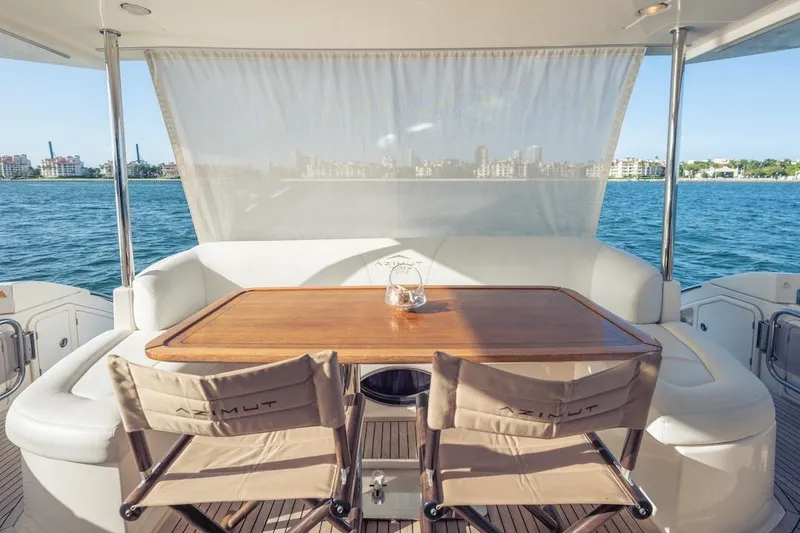 Slide: The Image of Luxury Azimut Evolution 2012 yacht deck with elegant seating and ocean view. - 30
