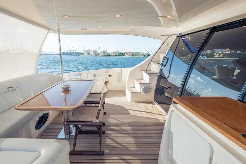 Slide: The Image of Luxurious 2012 Azimut Evolution yacht interior with elegant seating and ocean view. - 32