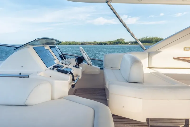 Slide: The Image of Luxurious 2012 Azimut Evolution yacht interior with modern helm and plush seating. - 34