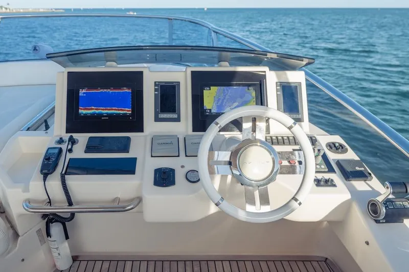 Slide: The Image of Cockpit of 2012 Azimut Evolution yacht with navigation screens and steering wheel. - 38