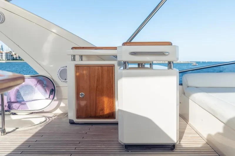 Slide: The Image of Luxurious 2012 Azimut Evolution yacht interior with wooden cabinetry and ocean view. - 39