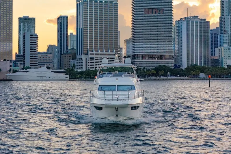 Slide: The Image of Azimut Evolution 2012 yacht cruising near city skyline at sunset. - 4