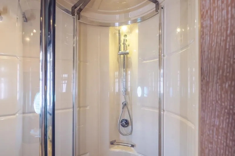 Slide: The Image of Luxurious shower in 2012 Azimut Evolution yacht, featuring sleek glass doors and modern fixtures. - 43