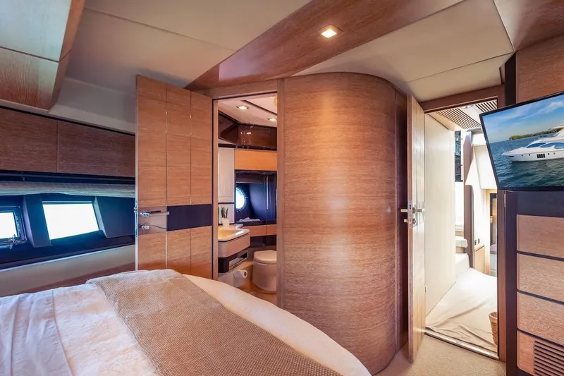 Slide: The Image of Luxurious interior of 2012 Azimut Evolution yacht, featuring a cozy bedroom and modern bathroom. - 45