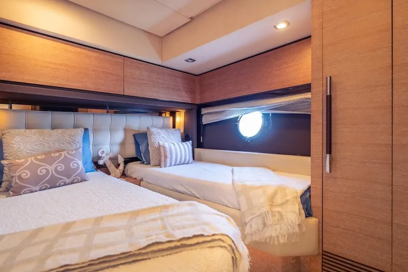 Slide: The Image of Luxurious 2012 Azimut Evolution yacht cabin with twin beds and elegant decor. - 47