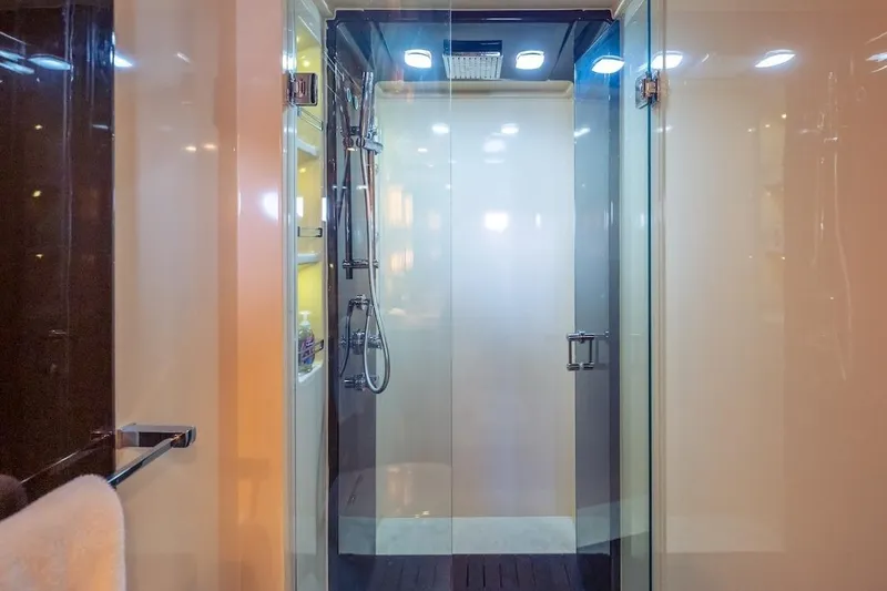 Slide: The Image of Luxurious shower area in 2012 Azimut Evolution yacht, featuring modern fixtures and glass doors. - 52