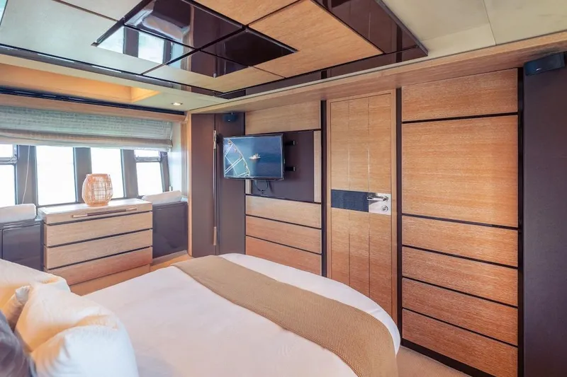 Slide: The Image of Luxurious interior of 2012 Azimut Evolution yacht with modern wood paneling and elegant decor. - 53